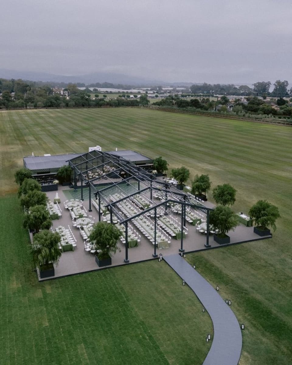 Aerial view of a glass event venue at dusk