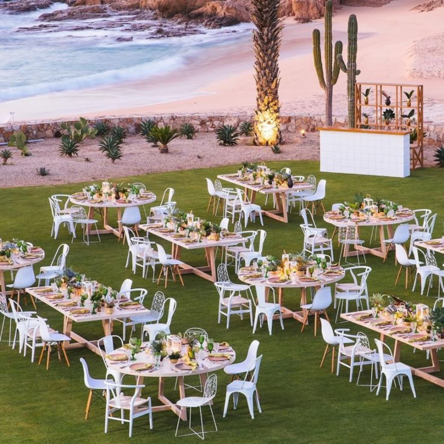 Dinner tables set by the sea